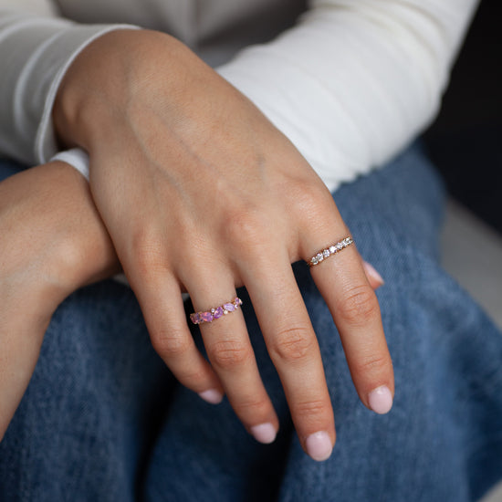 Close-up of hands with rings on a blurred background