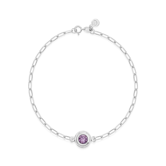 White gold bracelet with a purple round sapphire on a white background