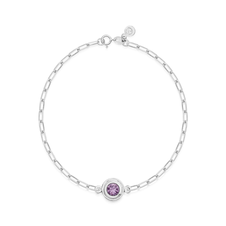 White gold bracelet with a purple round sapphire on a white background