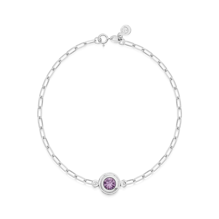 White gold bracelet with a purple round sapphire on a white background